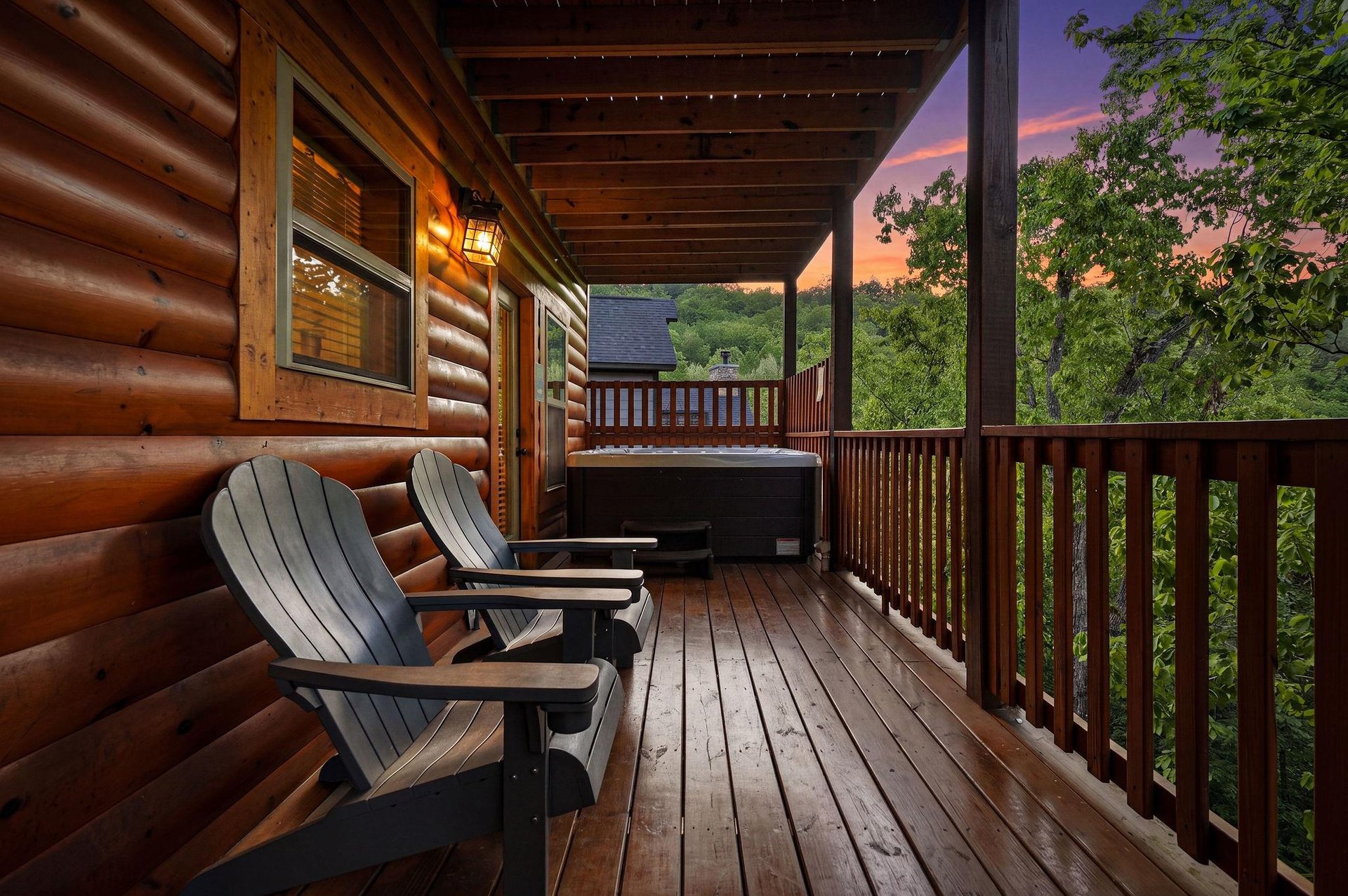 Unwind on your private deck with cozy Adirondack chairs and a bubbling hot tub as twilight paints the sky in stunning colors.