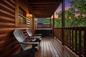 Unwind on your private deck with cozy Adirondack chairs and a bubbling hot tub as twilight paints the sky in stunning colors.