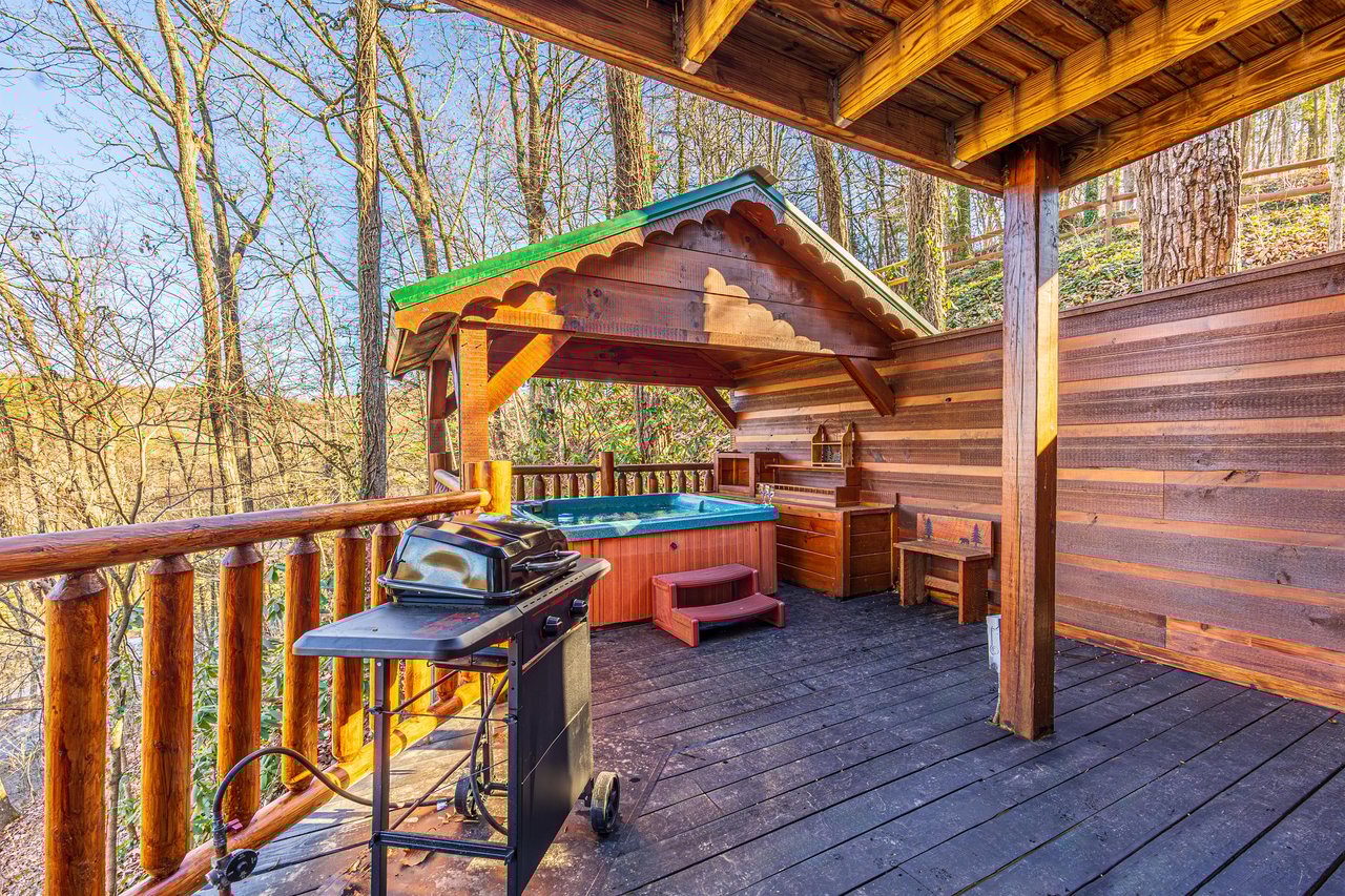 Hot tub on covered deck at Hidden Pleasure