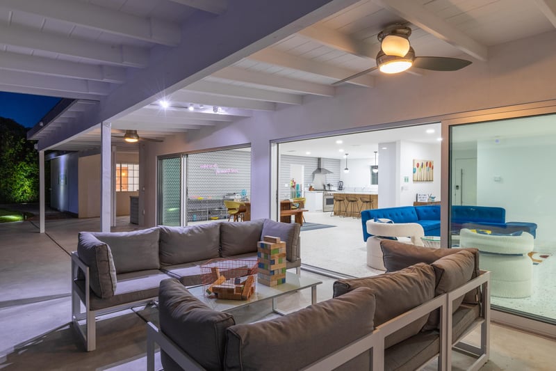 Gather around the outdoor covered lounge area