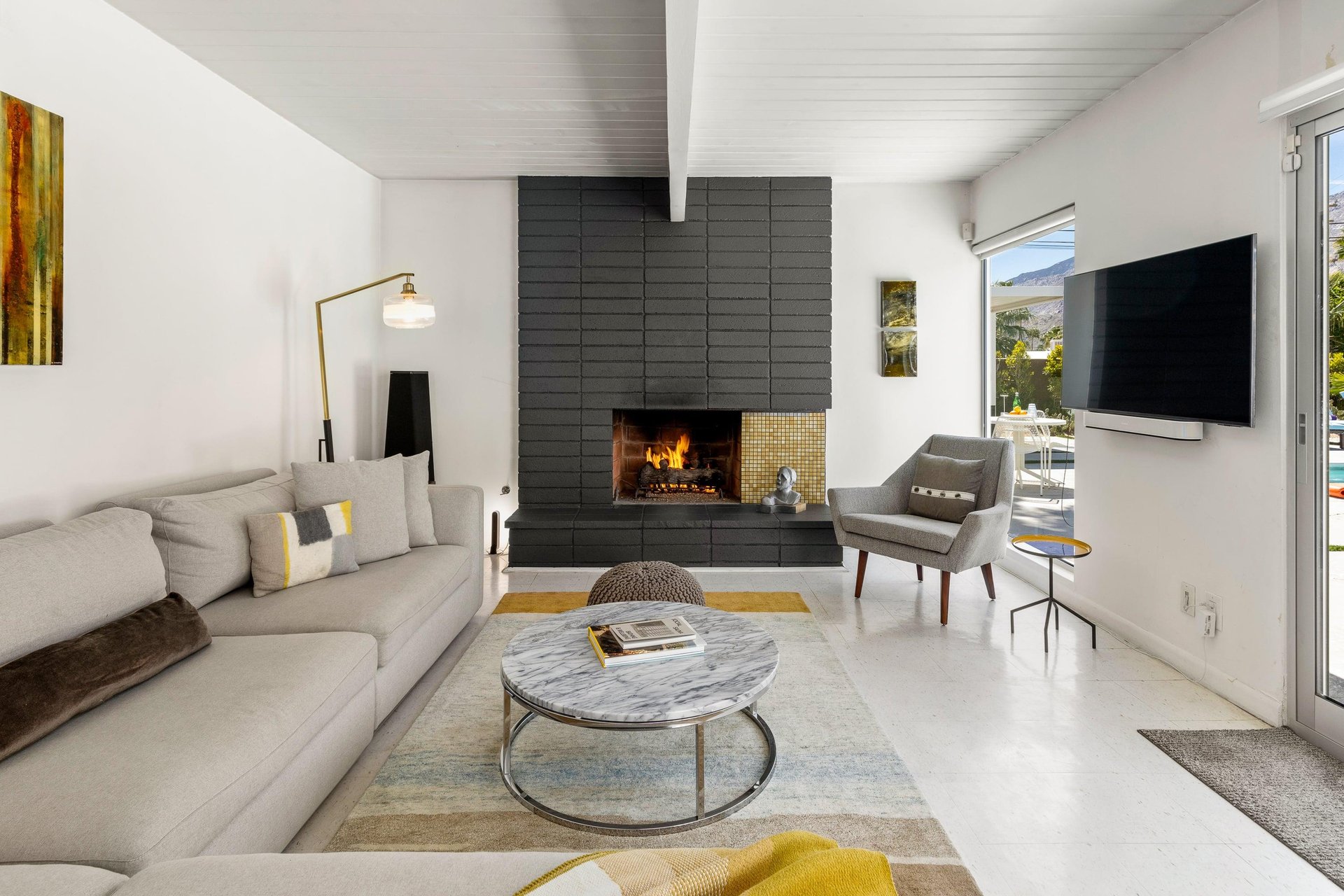Free flowing living room with gorgeous fireplace