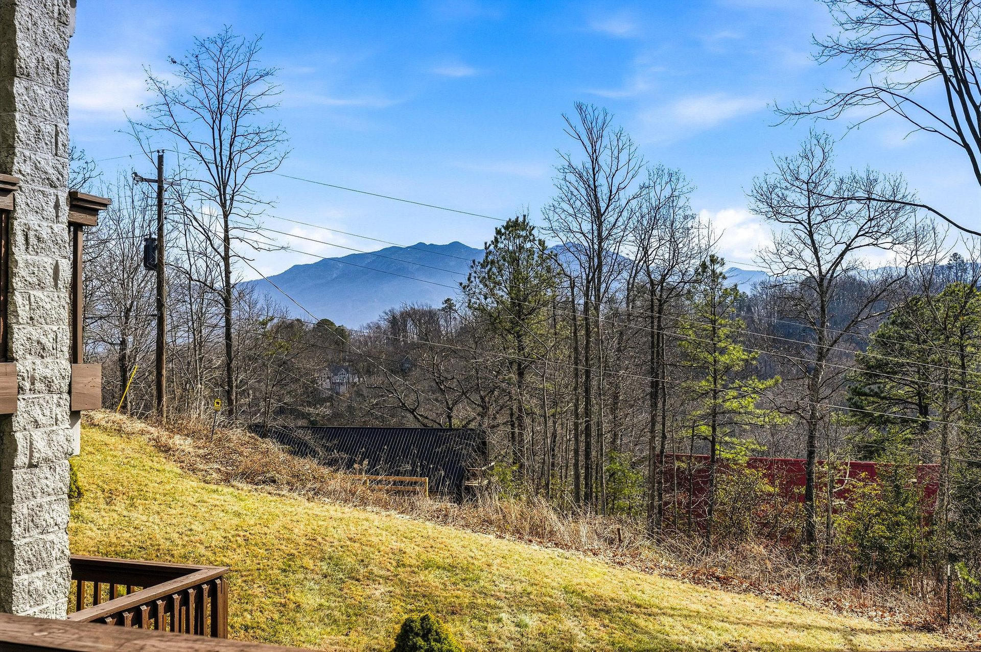 Stunning mountain views frame the propertys peaceful setting among rolling hills and native trees.