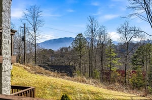 Stunning mountain views frame the propertys peaceful setting among rolling hills and native trees.