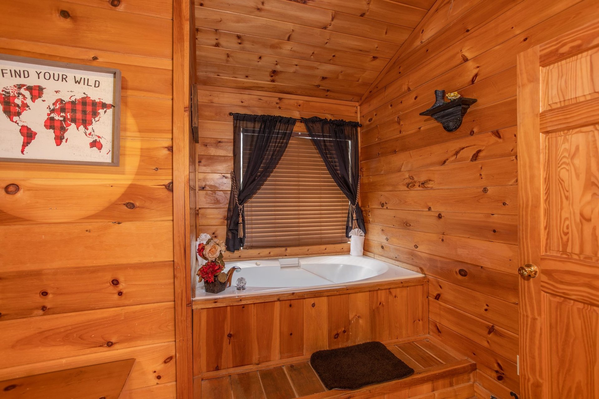 Jacuzzi tub in the upper bedroom at Hibernation Station, a 3bedroom cabin rental located in Pigeon Forge