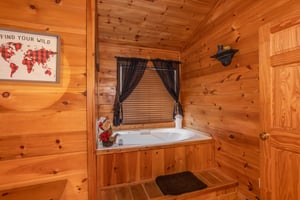 Jacuzzi tub in the upper bedroom at Hibernation Station, a 3bedroom cabin rental located in Pigeon Forge