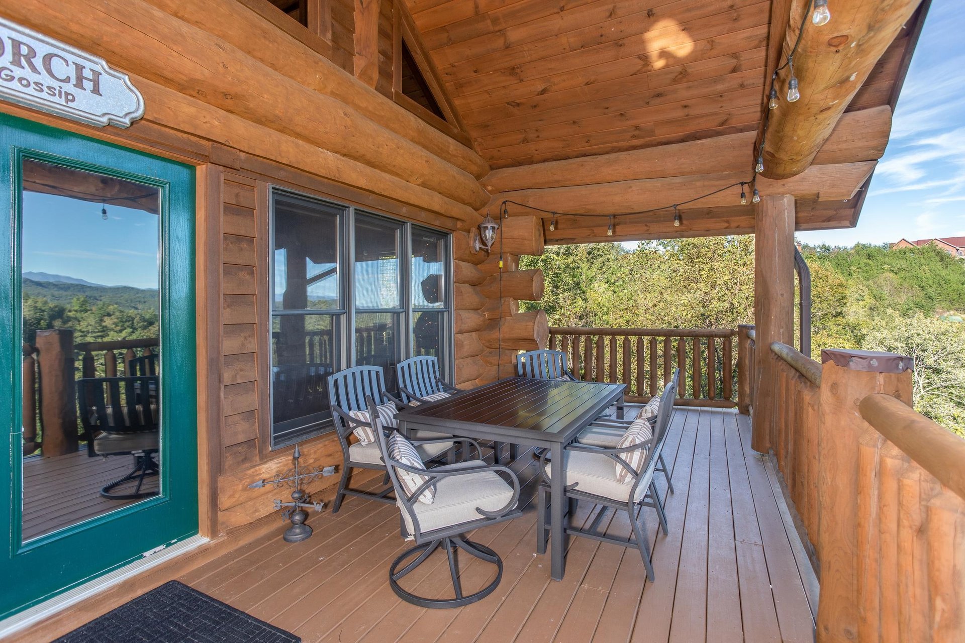 Outdoor dining set with seating for six on the covered deck at Great View Lodge, a 5bedroom cabin rental located in Pigeon Forge