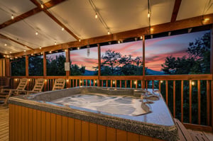 Soak away your cares in the hot tub while watching the sky blaze with color at sunset, framed by mountain silhouettes and treetops—your private escape under the stars.