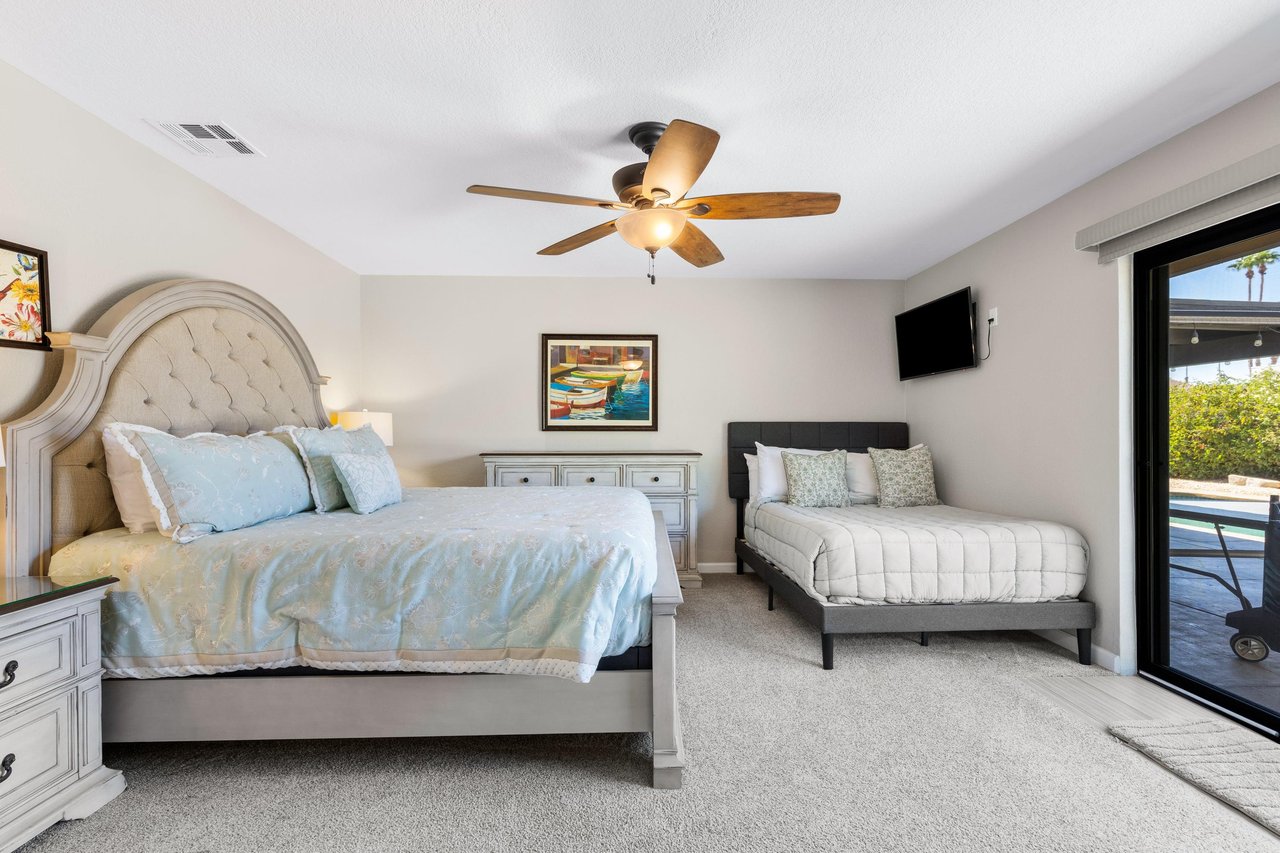 King size bed and double size bed, flatscreen TV, patio access, and ensuite bathroom.
