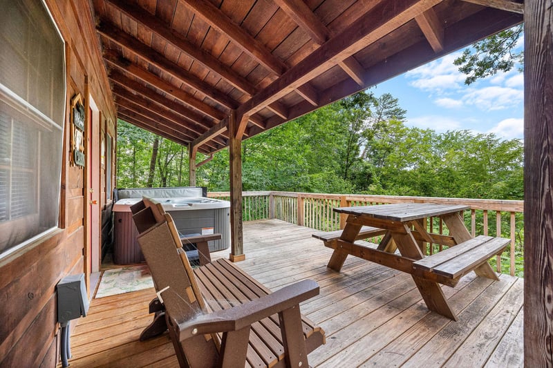 Picnic Table  Hot Tub at beary good time a 1 bedroom cabin rental located in pigeon forge