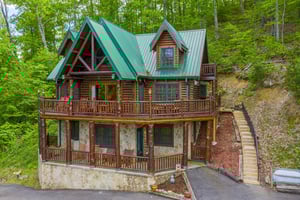 Living room with sofa bed and stone fireplace