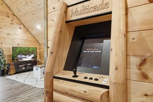 Challenge friends to classic arcade games in your rustic game room, complete with authentic wood finishes and cozy mountain charm.