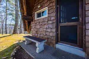 Bench seat on porch at Ever After, a 1 bedroom cabin rental located in Gatlinburg