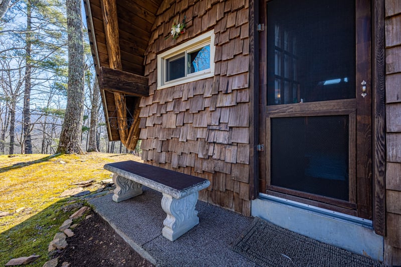Bench seat on porch at Ever After, a 1 bedroom cabin rental located in Gatlinburg