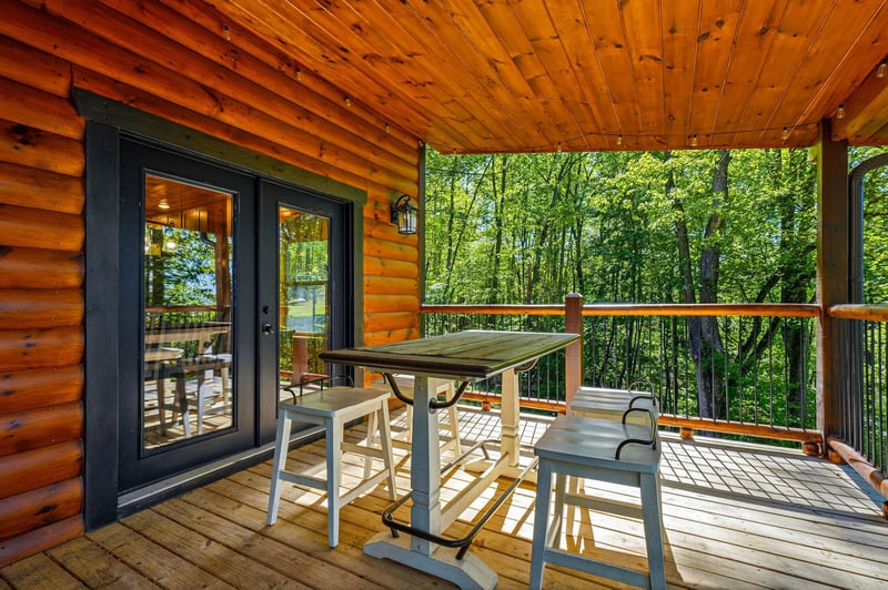 Enjoy morning coffee on your private deck surrounded by lush forest canopy, where rustic charm meets modern comfort.