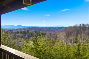 Step onto your private balcony and breathe in the fresh mountain air while taking in sweeping views of rolling hills and endless blue sky.