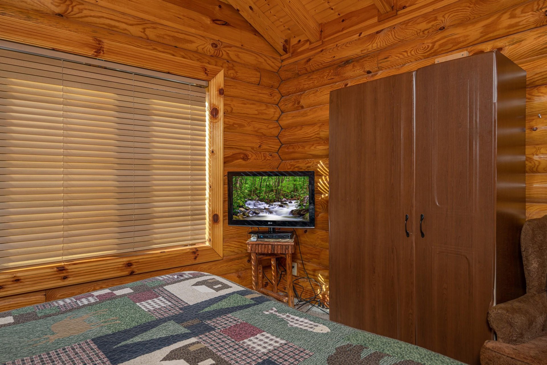 TV and armoire in a bedroom at Gone Fishin, a 2bedroom cabin rental located in Pigeon Forge