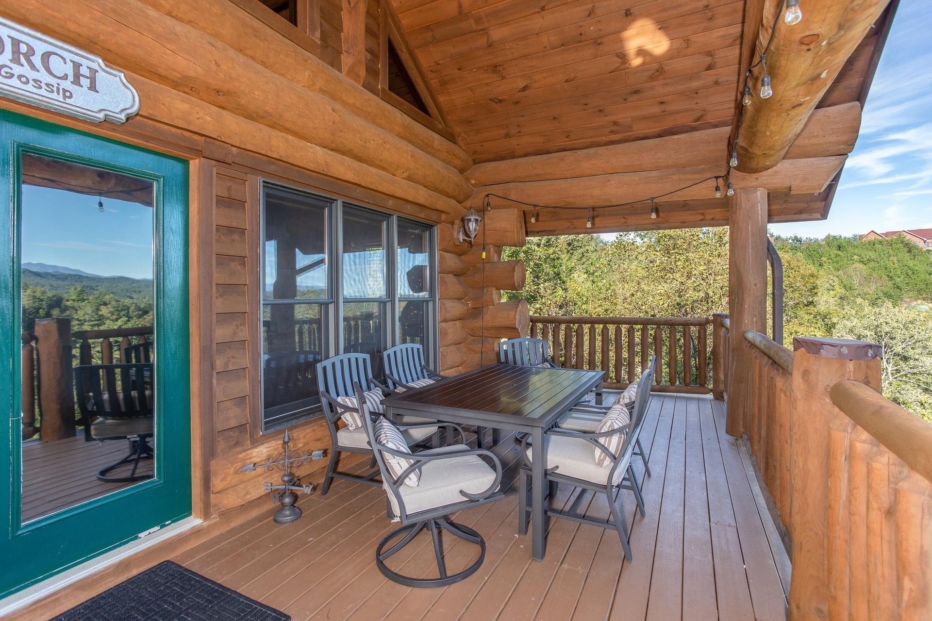 Outdoor dining set with seating for six on the covered deck at Great View Lodge, a 5bedroom cabin rental located in Pigeon Forge