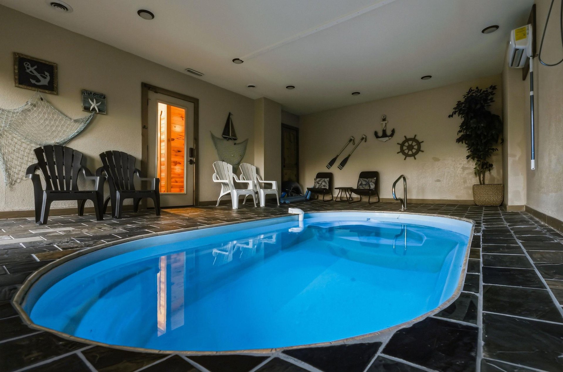 Dive into your private indoor oasis where nautical charm meets relaxation. The heated pool beckons for yearround swims while poolside seating invites cozy conversations.