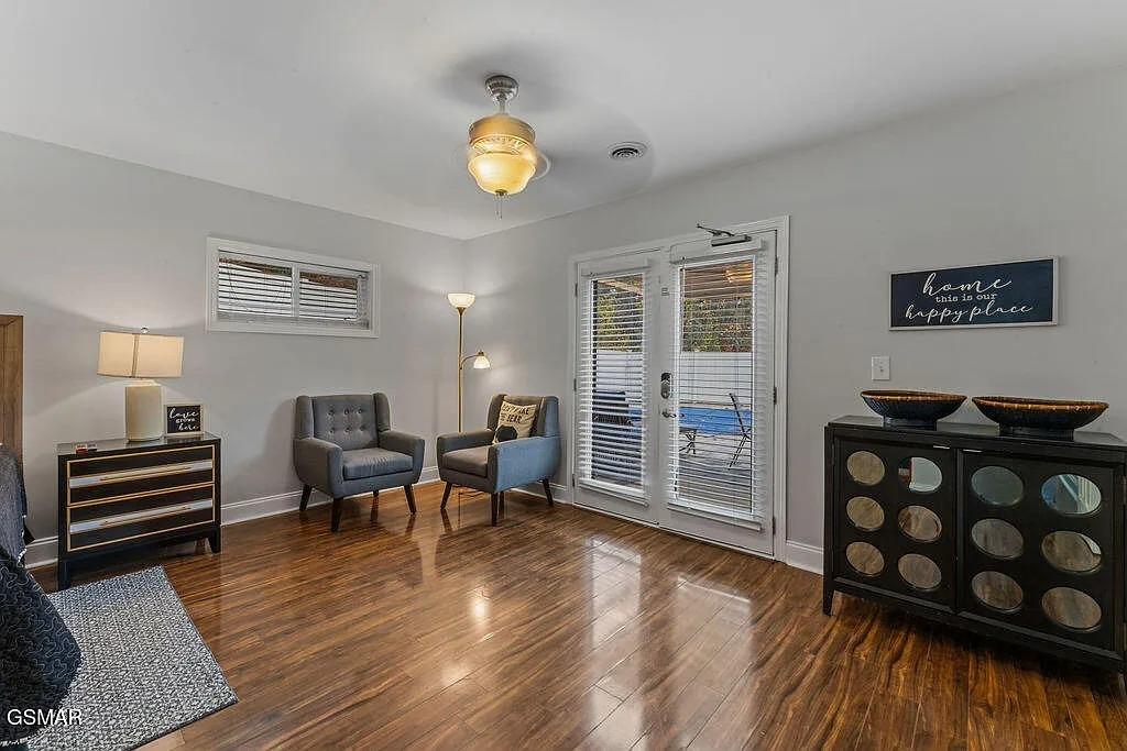 Step into your welcoming living space with gleaming hardwood floors and charming decor that whispers home is our happy place.