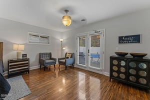 Step into your welcoming living space with gleaming hardwood floors and charming decor that whispers home is our happy place.