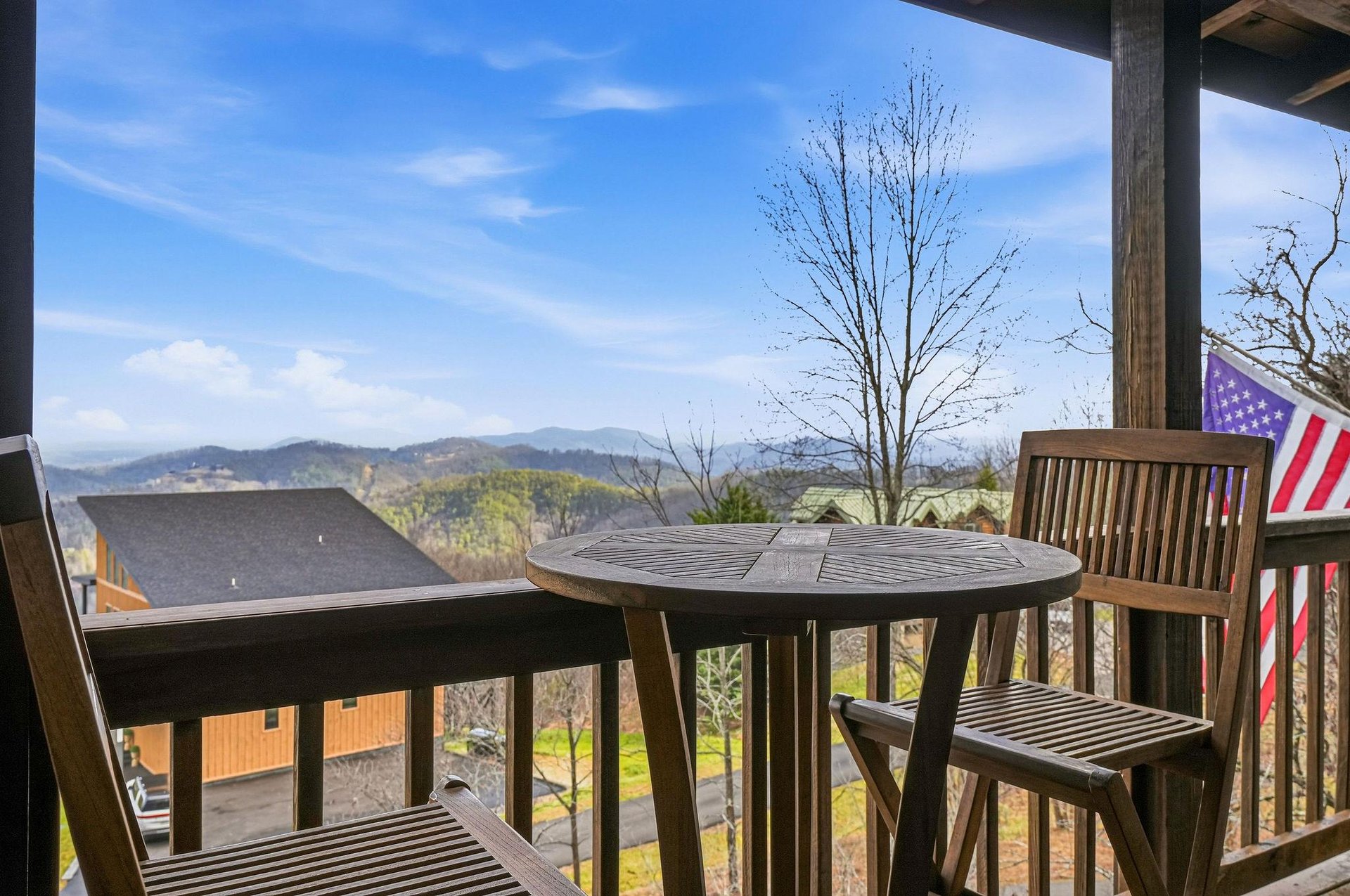 Sip your morning coffee while soaking in breathtaking mountain vistas from your private balcony, complete with comfortable seating for two.