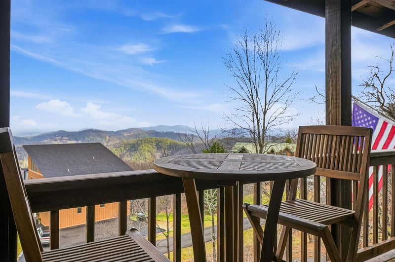 Sip your morning coffee while soaking in breathtaking mountain vistas from your private balcony, complete with comfortable seating for two.