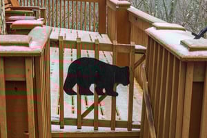 Snowy open deck at Lazy Bear Retreat, a 4 bedroom cabin rental located in Pigeon Forge