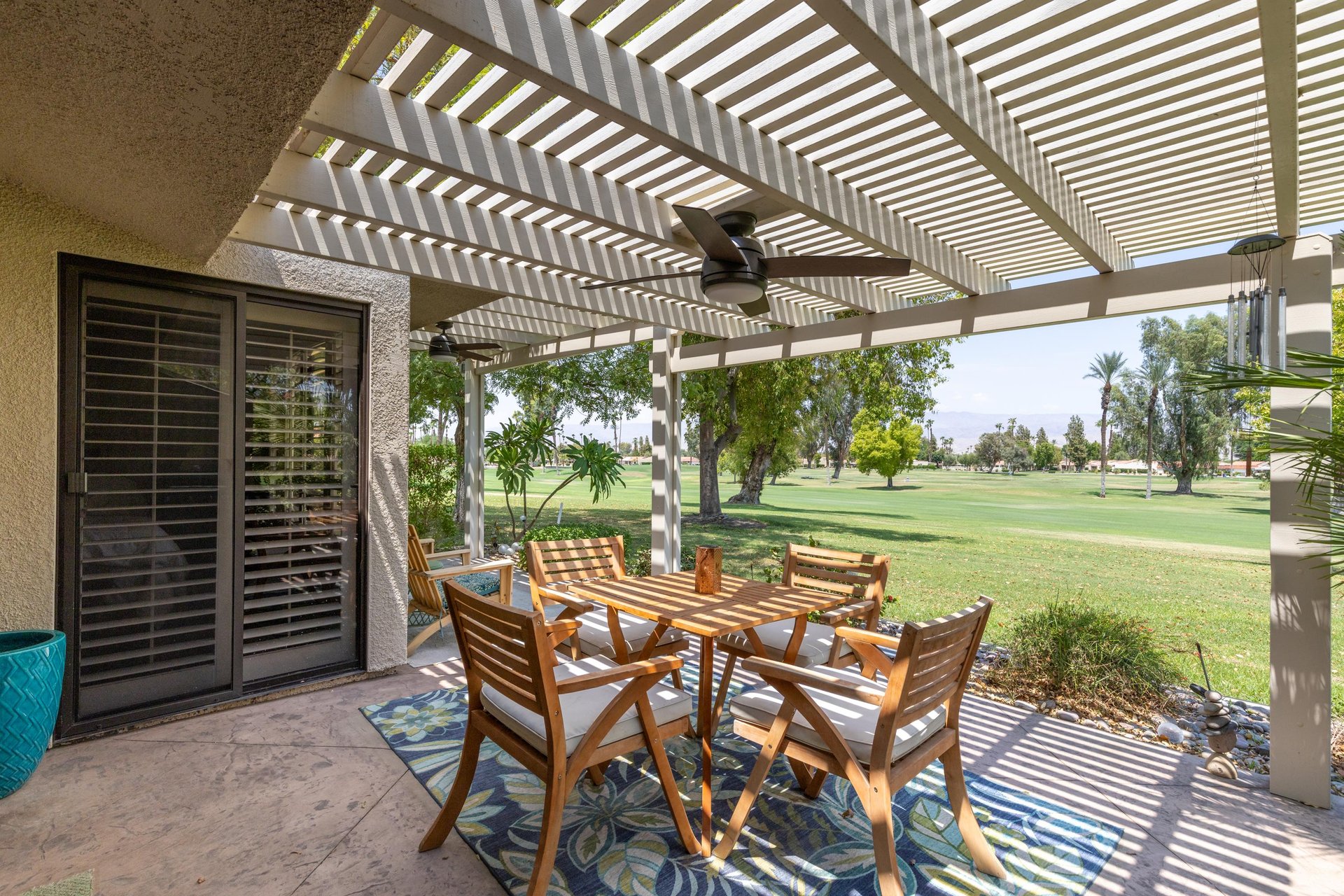 Golf course views can be seen from the back patio and outdoor dining area.