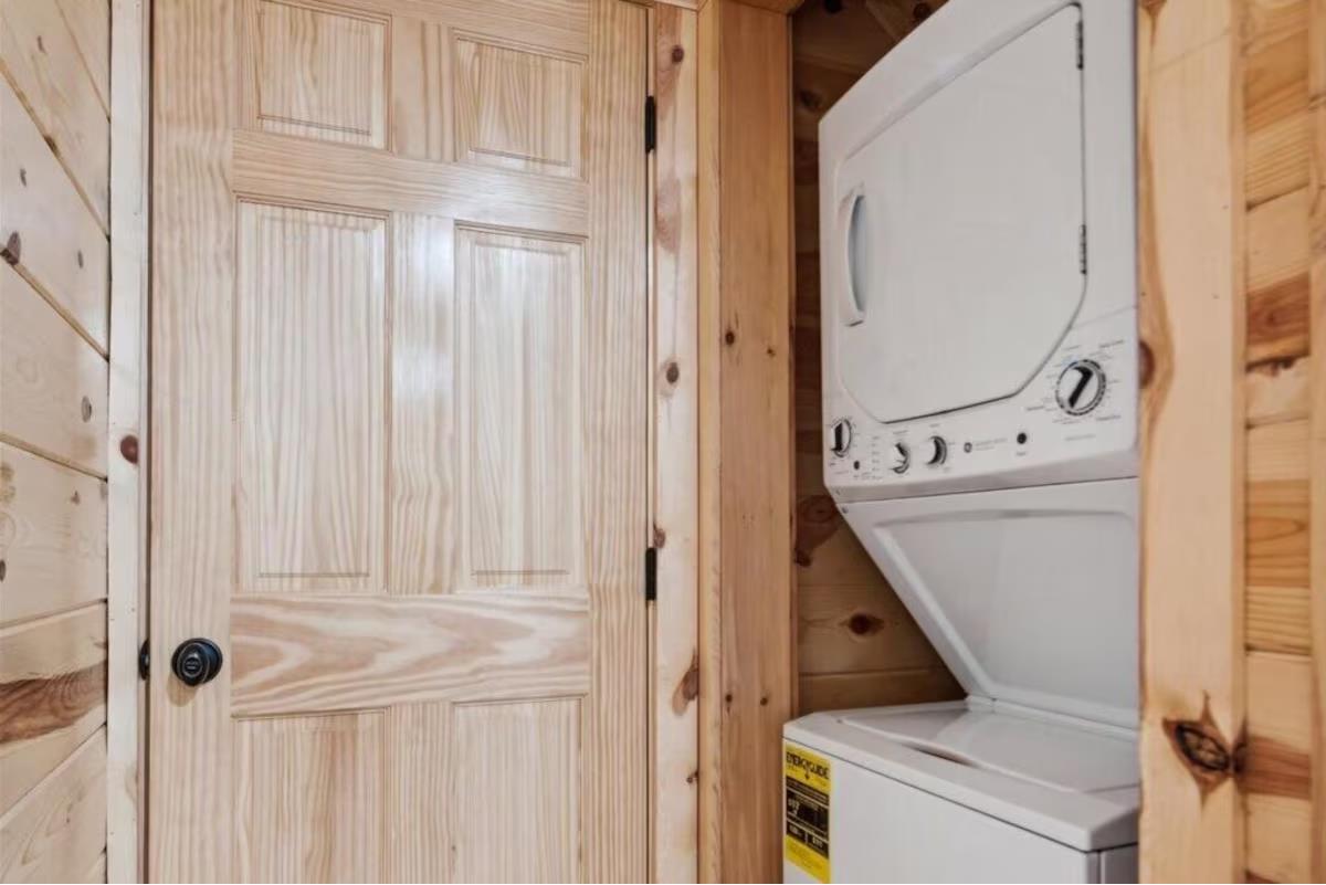 Your private laundry facilities make longer stays effortless, with a washer and dryer tucked perfectly into this warm woodlined space.