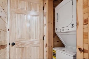 Your private laundry facilities make longer stays effortless, with a washer and dryer tucked perfectly into this warm woodlined space.