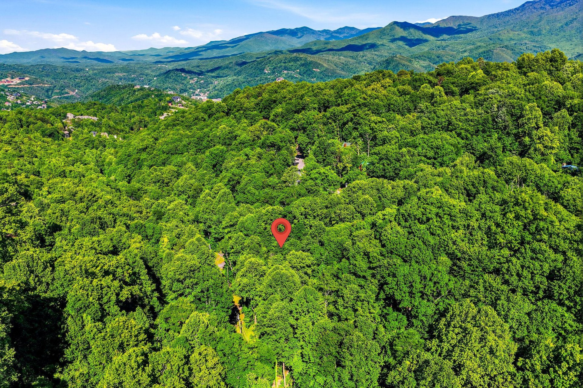 Nestled in lush forest with stunning mountain views, this property offers a peaceful retreat surrounded by natural beauty and the charm of nearby communities.