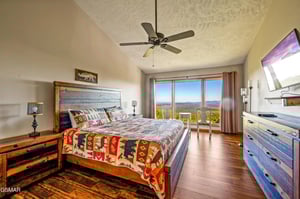 Wake up to breathtaking mountain views from your comfortable king bed, complete with rustic charm and modern TV entertainment.
