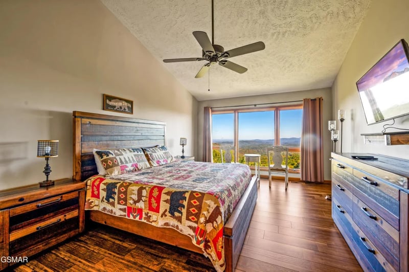Wake up to breathtaking mountain views from your comfortable king bed, complete with rustic charm and modern TV entertainment.