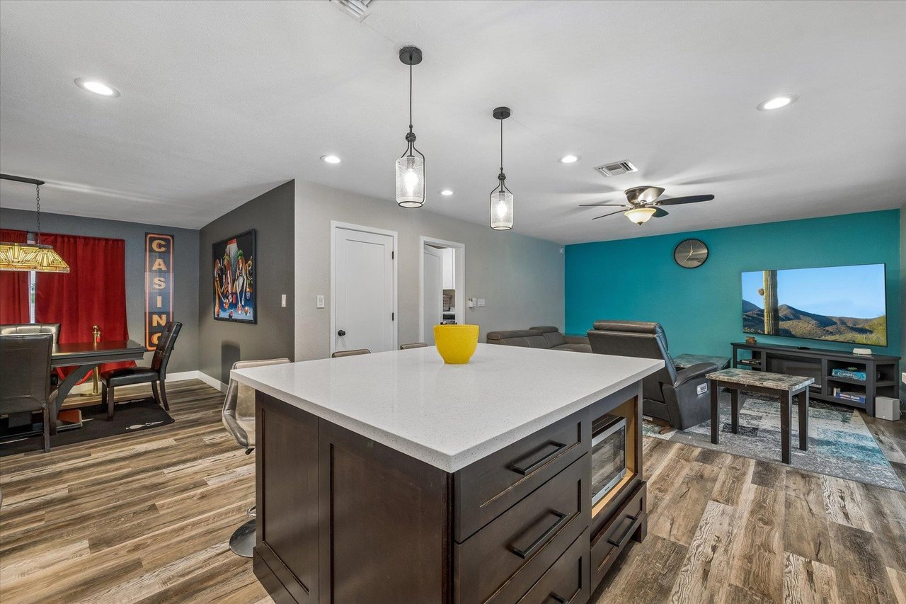 View of the kitchen, living area, and dining area.