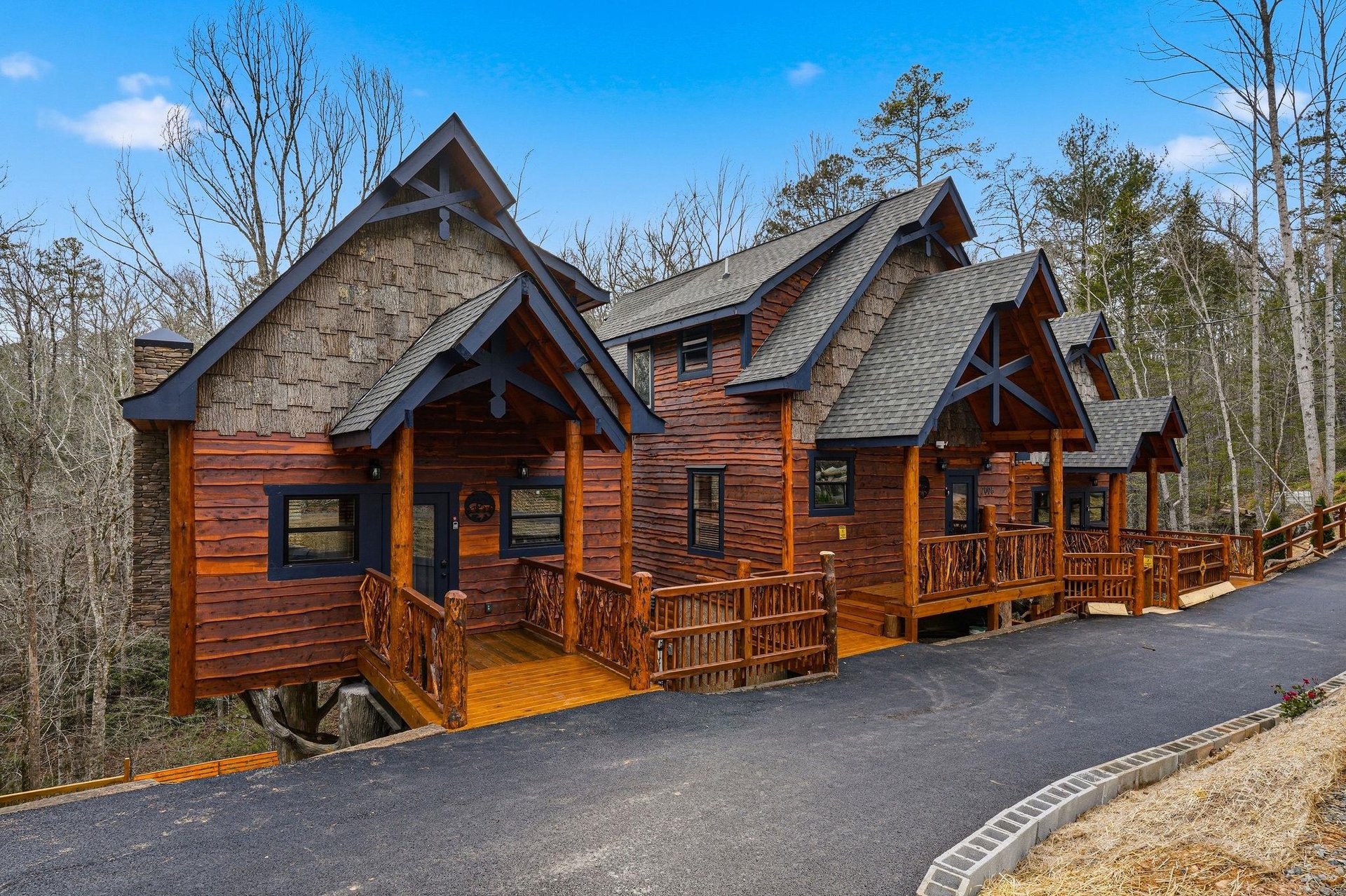 Stunning mountain cabin with rustic charm and multiple decks set among peaceful wooded surroundings.