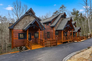 Stunning mountain cabin with rustic charm and multiple decks set among peaceful wooded surroundings.