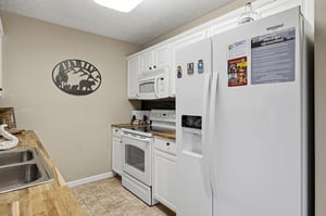 Your fully equipped kitchen features modern appliances and ample counter space for preparing memorable meals during your stay.