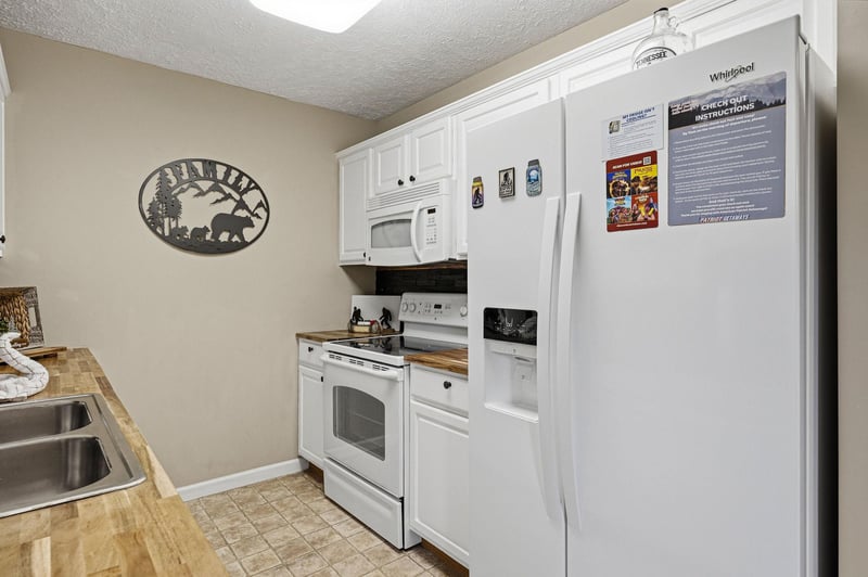 Your fully equipped kitchen features modern appliances and ample counter space for preparing memorable meals during your stay.