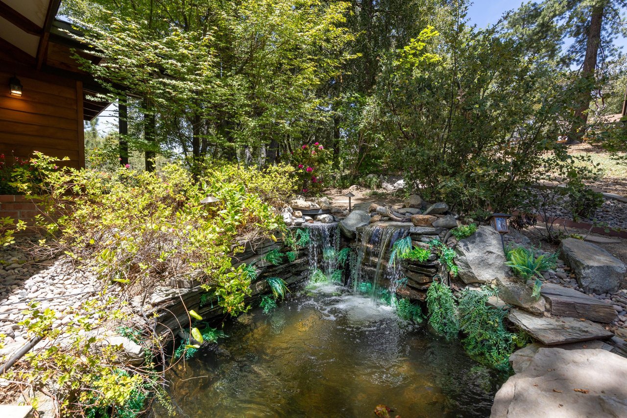 Koi pond with two waterfalls off the deck.