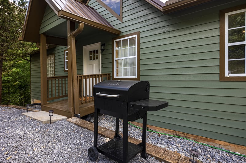 Front door to Cabbyshack cabin with grill