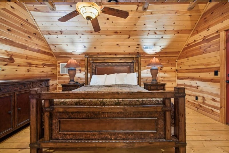 Unwind in your rustic log cabin bedroom, where handcrafted furniture and warm wood create the perfect mountain retreat atmosphere.