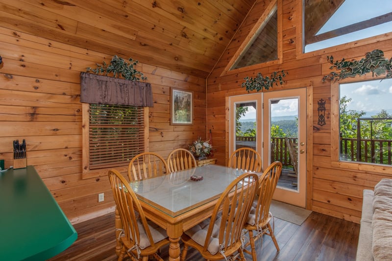 dining room with seating for six at angels majestic view a 3 bedroom cabin rental located in pigeon forge
