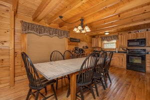 Dining table for 8 at Bears Dont Bluff, a 3 bedroom cabin rental located in Pigeon Forge