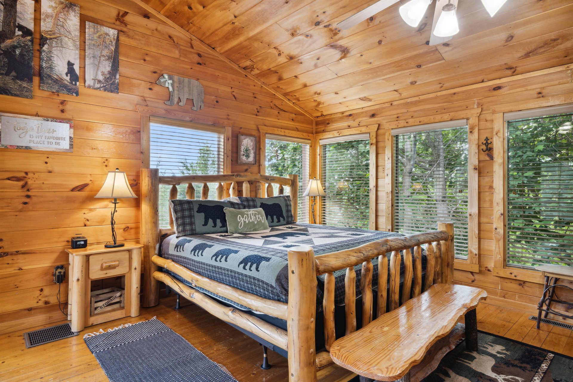 King bed with bench and several windows