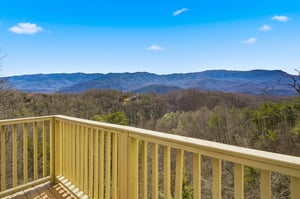 Breathtaking mountain panorama stretches endlessly before this elevated balcony perch in the scenic foothills.