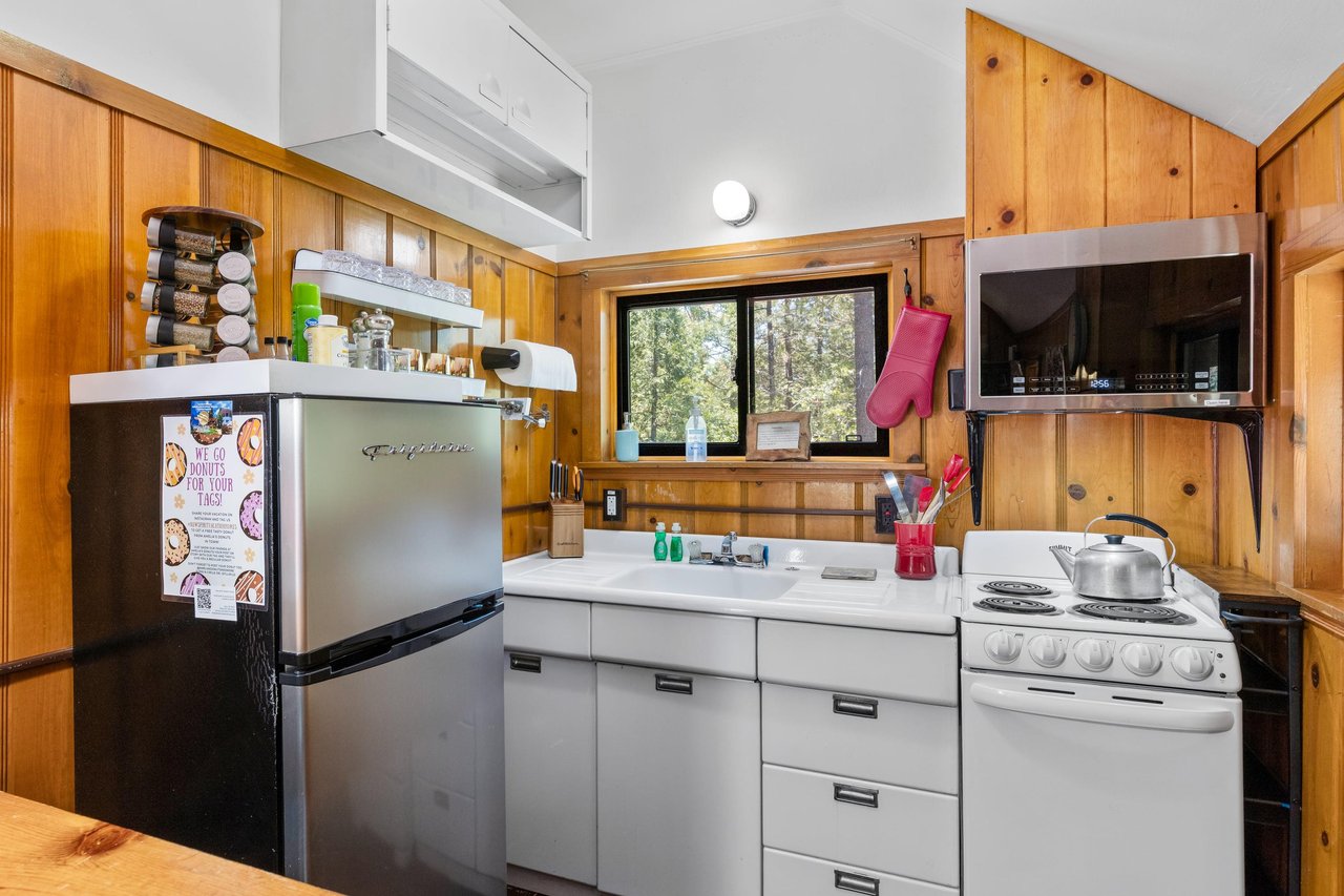 Full size kitchen located next to the sleeping area.