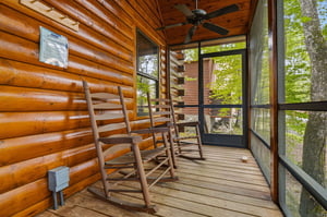 Relax on your private screened porch with rocking chairs overlooking peaceful woods—the perfect spot to unwind with morning coffee.