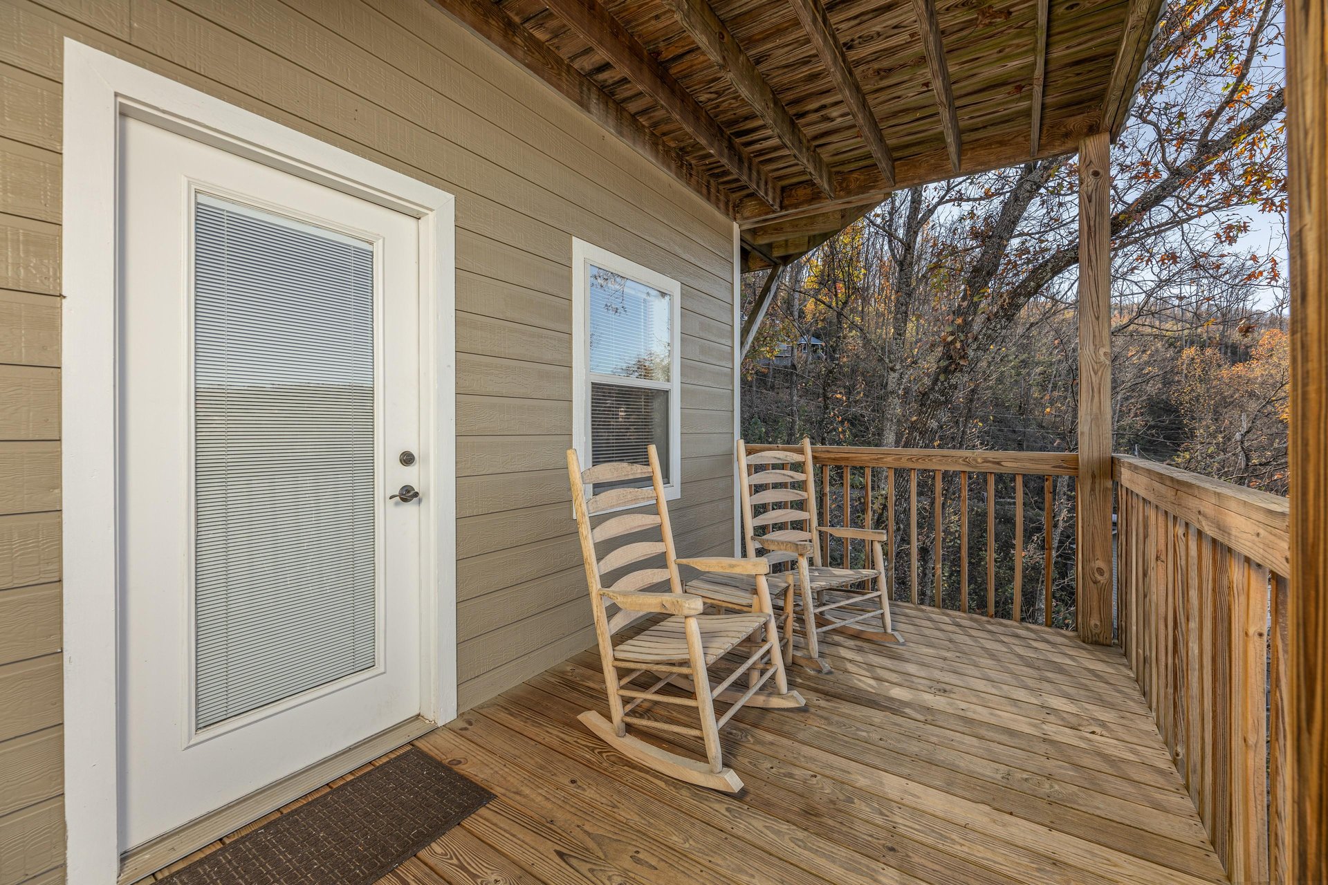 Rocking chairs on the deck at Le Bear Chalet, a 7 bedroom cabin rental located in Gatlinburg