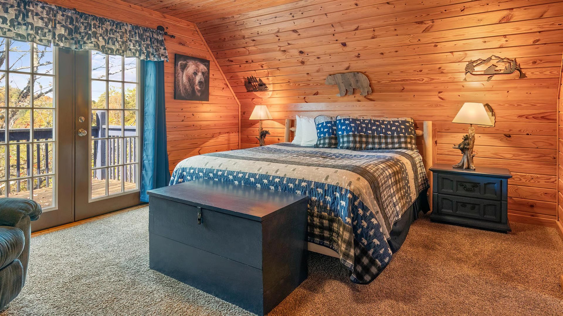 Cozy up in your rustic retreat with warm woodpaneled walls, plush bedding, and charming wildlife touches that create the perfect mountain getaway atmosphere.