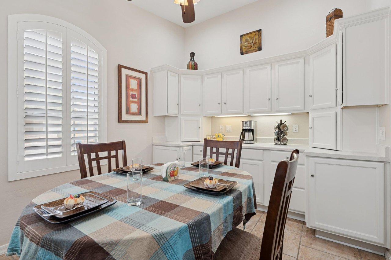 Inviting dining room with seating for four, plenty of storage